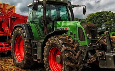 Tractor-green-summer-field-e1615987253684.jpg